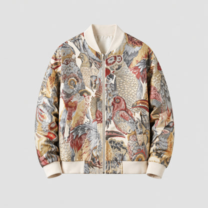 A zip-front bomber jacket with a detailed vintage-style bird print in beige, brown, red, and gray tones, featuring ribbed cream collar, cuffs, and hem, shown against a light neutral background with a textured gray floor.